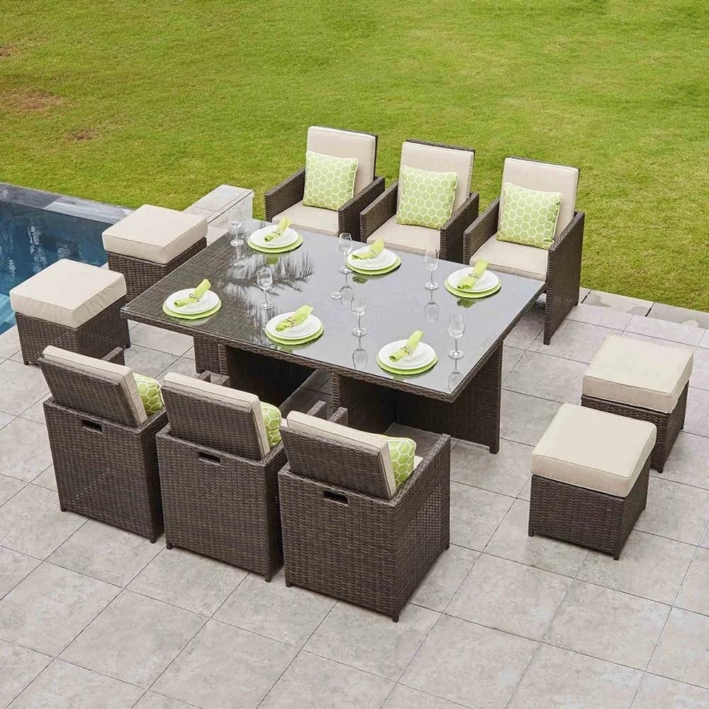 Elevate your outdoor dining with the 11-piece Wicker Dining Set with Cushions by Direct Wicker.