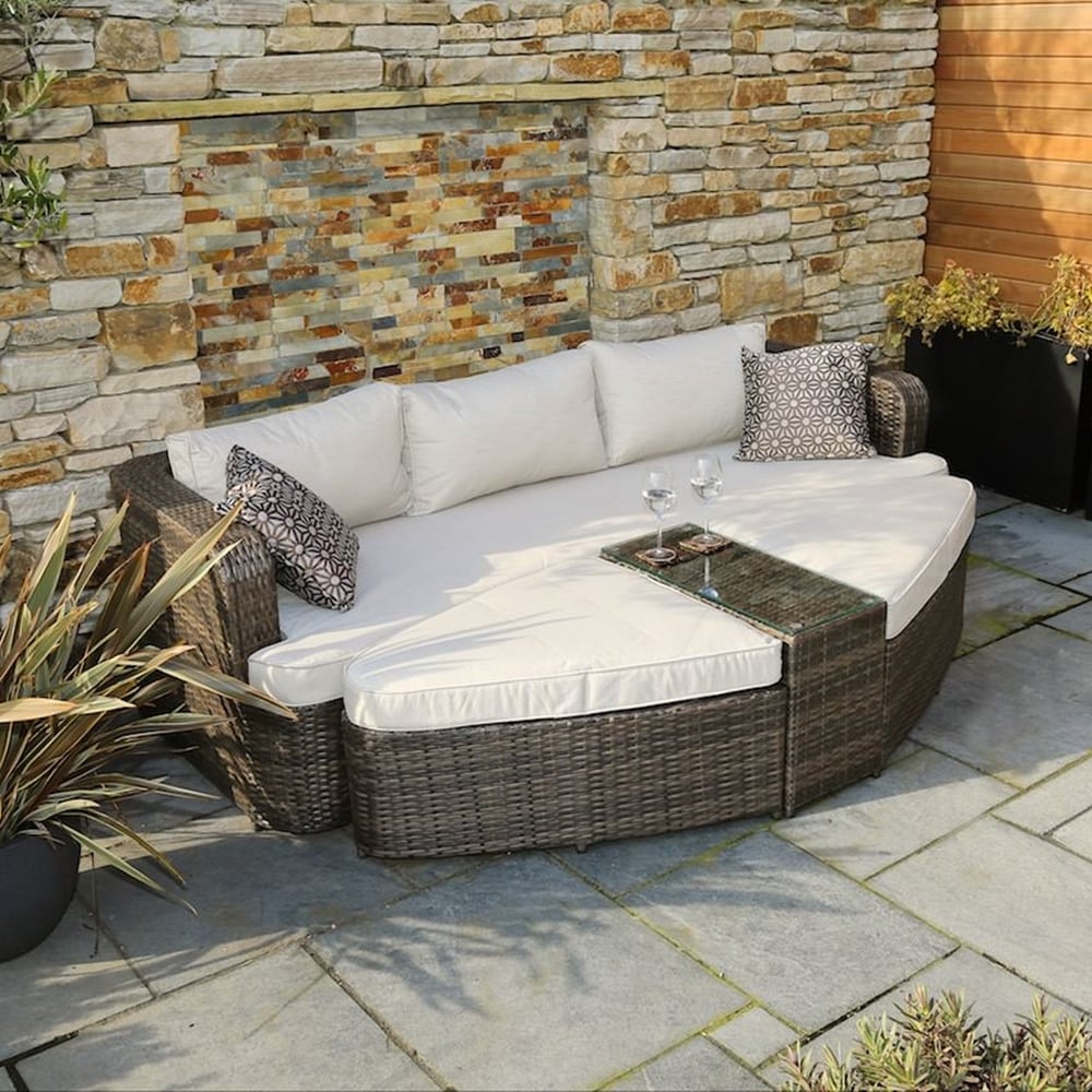 Upgrade your outdoor space with this Outdoor 4-piece Rattan Daybed Sofa Set by Direct Wicker.