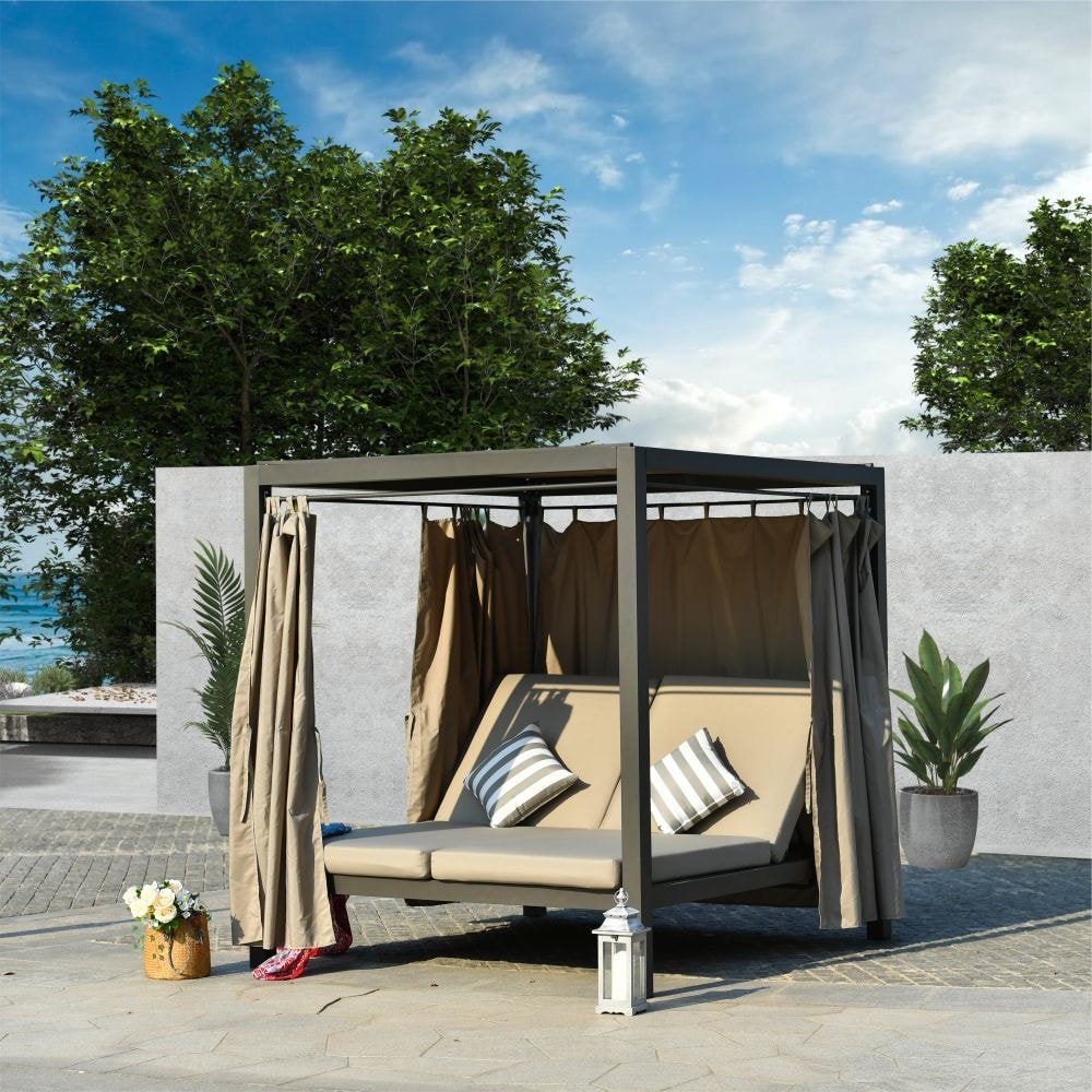 Enjoy the perfect outdoor getaway with the Direct Wicker Outdoor Adjustable Daybed with Canopy Patio Steel Lounge Set.